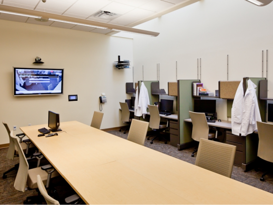 Graduate Dental Student work area and study hall. 10 workstation plus conference table.  The monitor is connected to the ORs.